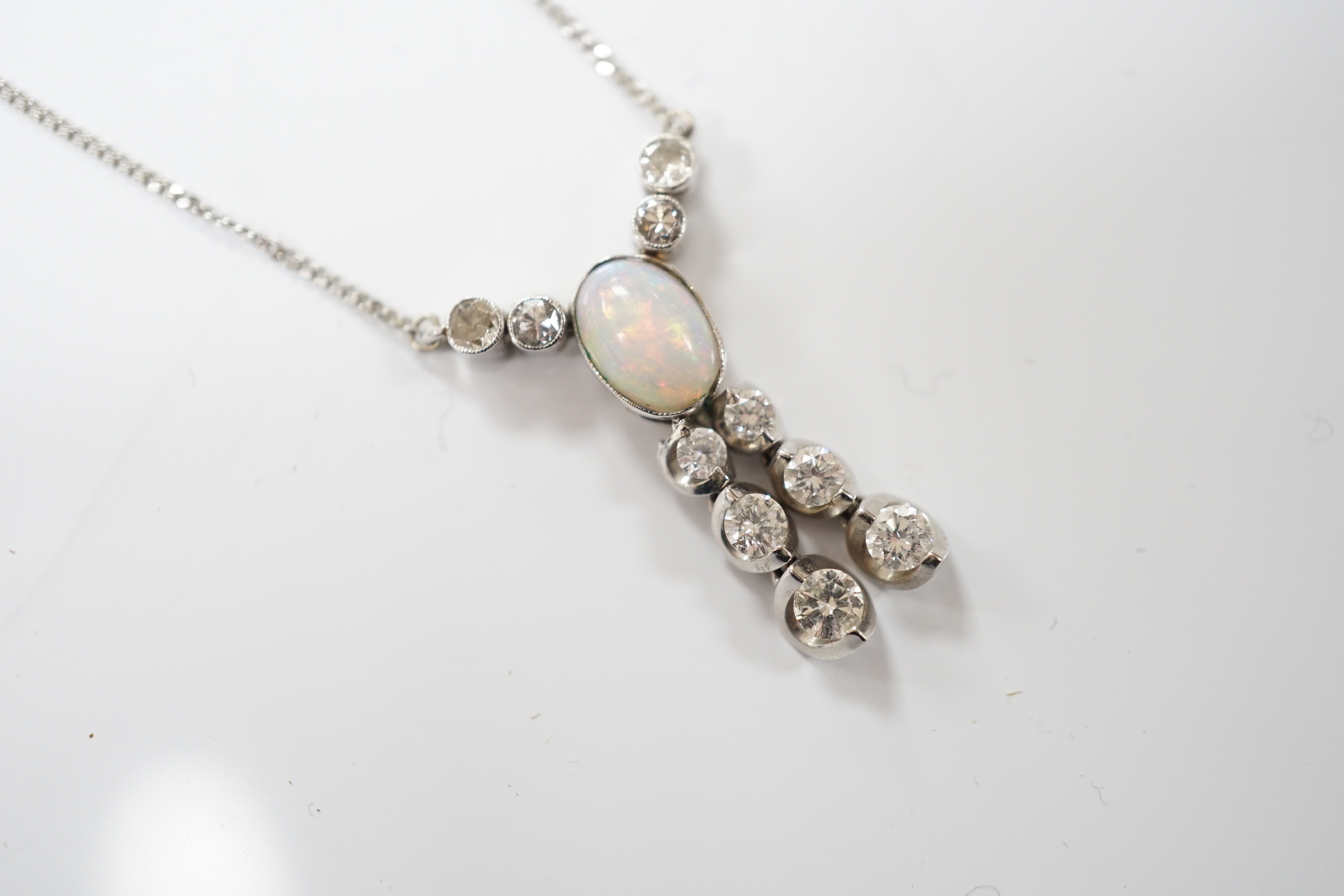 A modern 18ct white gold, white opal and diamond cluster set double drop pendant necklace, overall 56cm, gross weight 4.1 grams.
